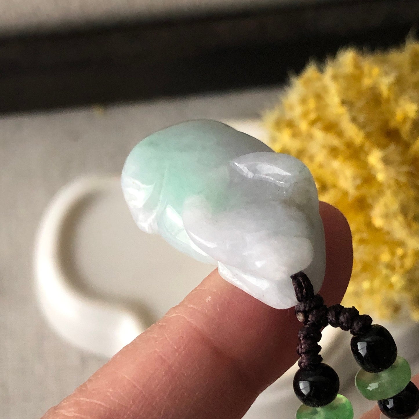 30mm Icy Green Jadeite Jade Cow Pendant Display