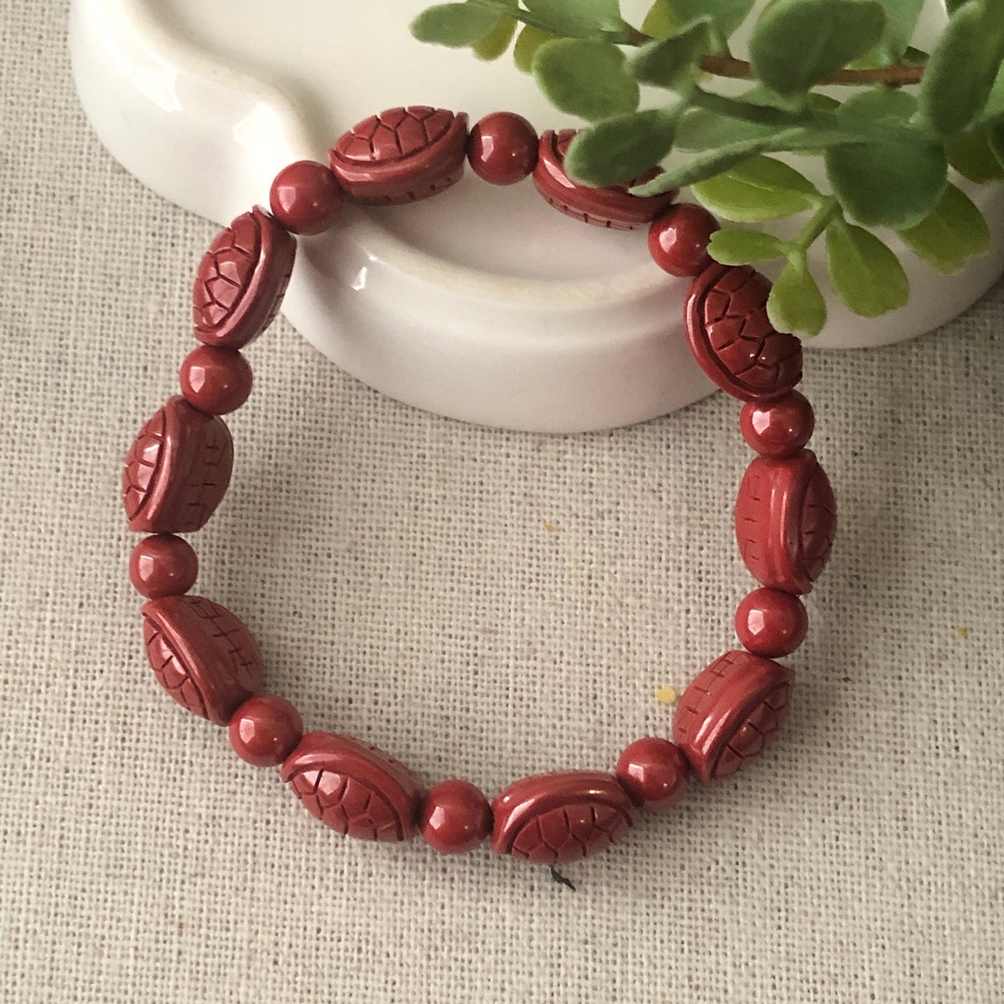 12.5 x 10.5 mm Cinnabar Bead Bracelet with Carved Turtle Shell
