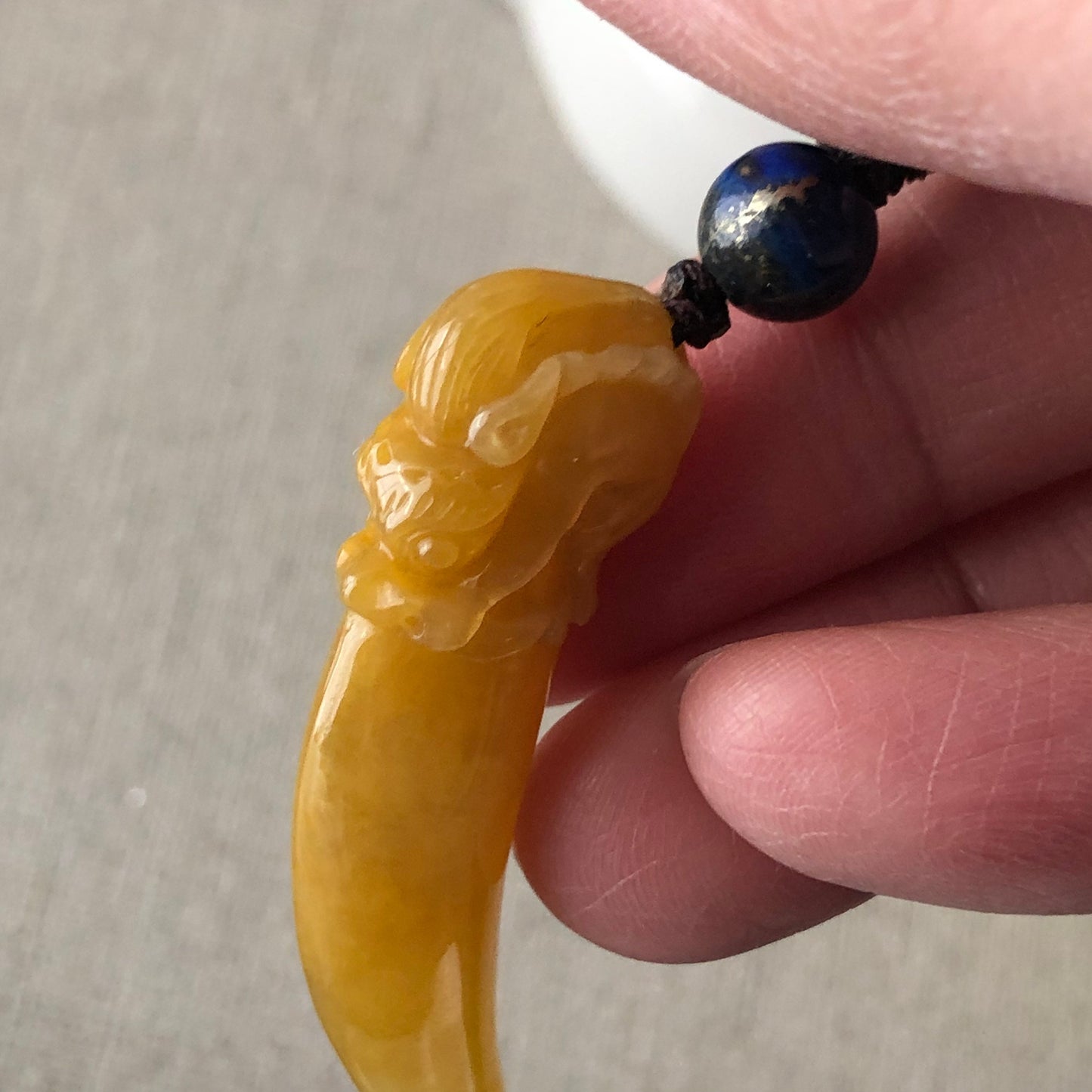 49mm Icy Yellow Carved Dragon Tooth Jadeite Jade Pendant