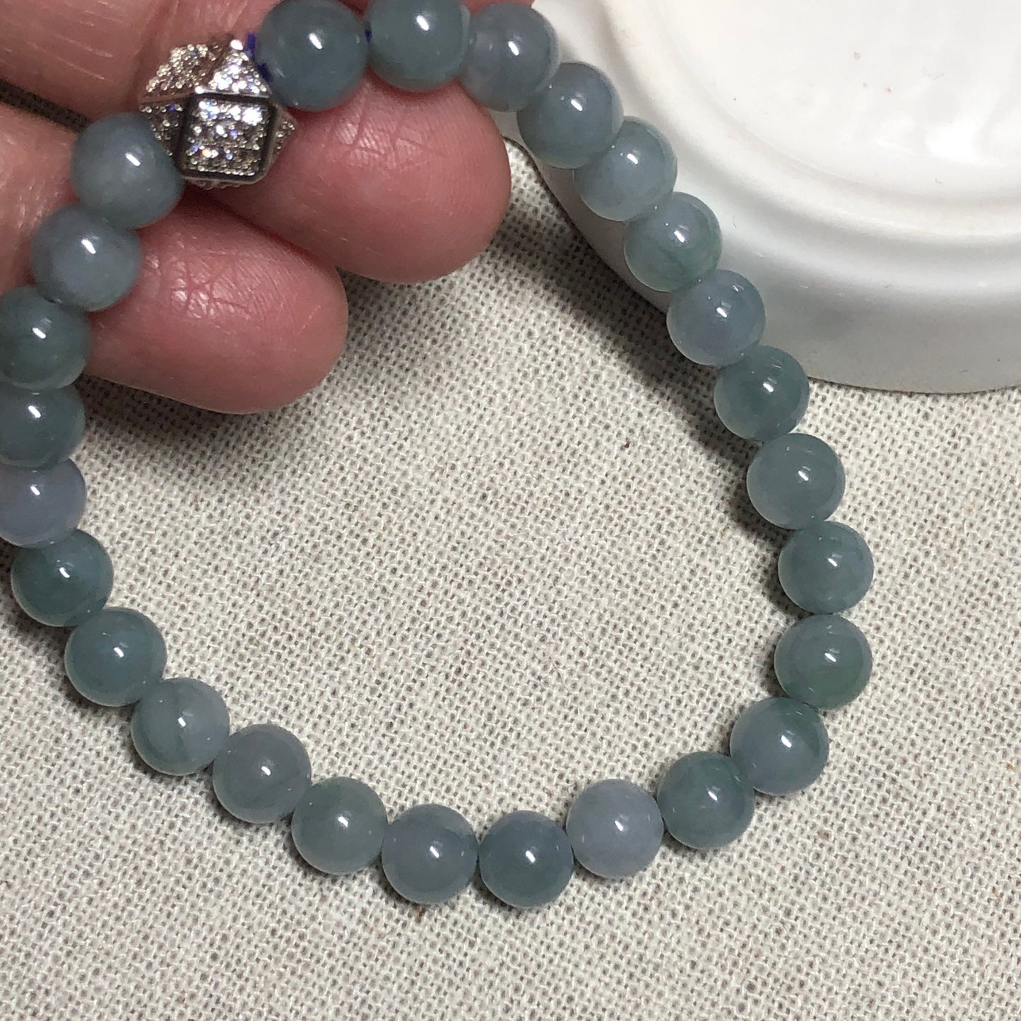 6.6 mm Grade A Icy Glutinous Sky Blue with Green Float Flowers Jadeite Jade Bead Bracelet 26 pcs.