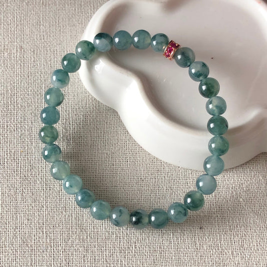 6.6 mm Grade A Icy Green Float Flowers Jadeite Jade Bead Bracelet 29 pcs.