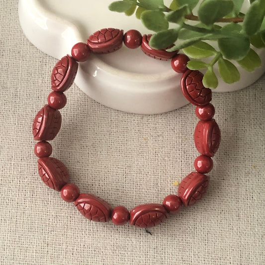 12.5 x 10.5 mm Cinnabar Bead Bracelet with Carved Turtle Shell