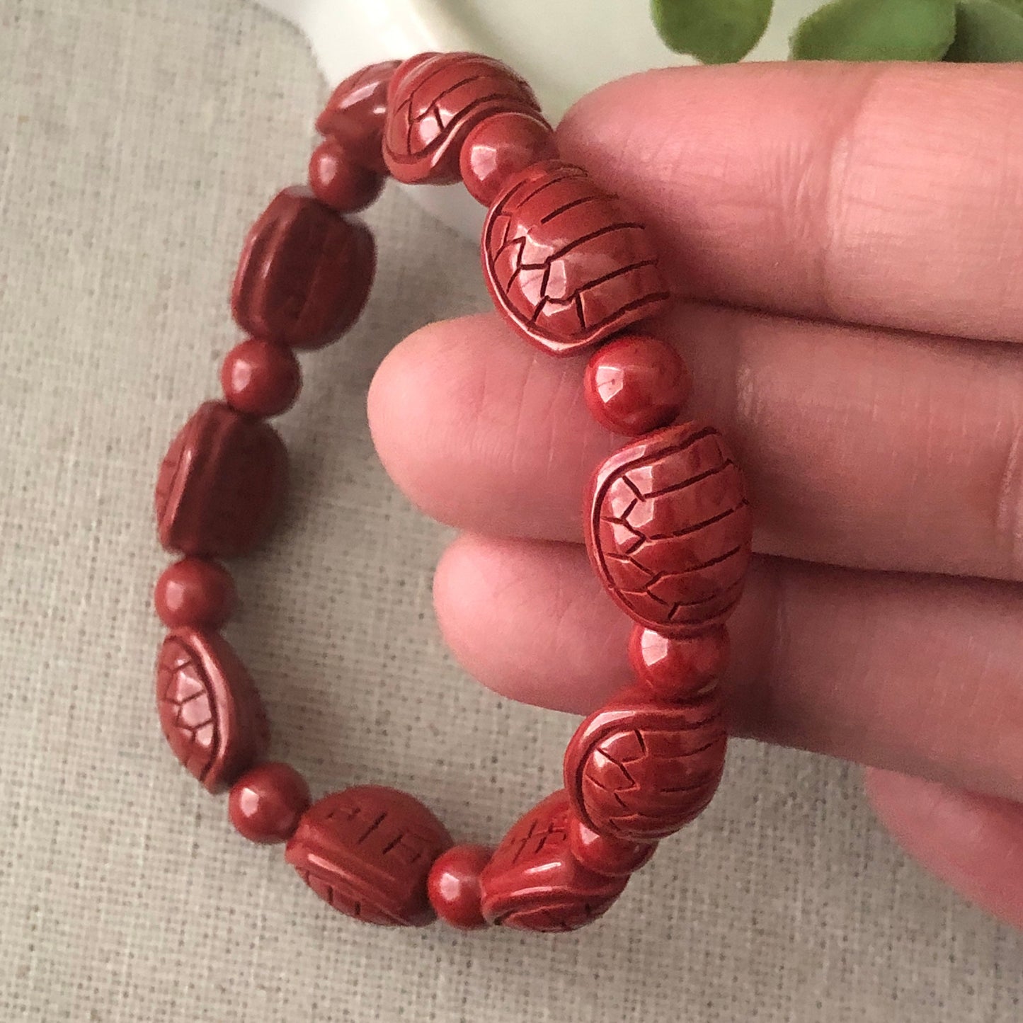 12.5 x 10.5 mm Cinnabar Bead Bracelet with Carved Turtle Shell